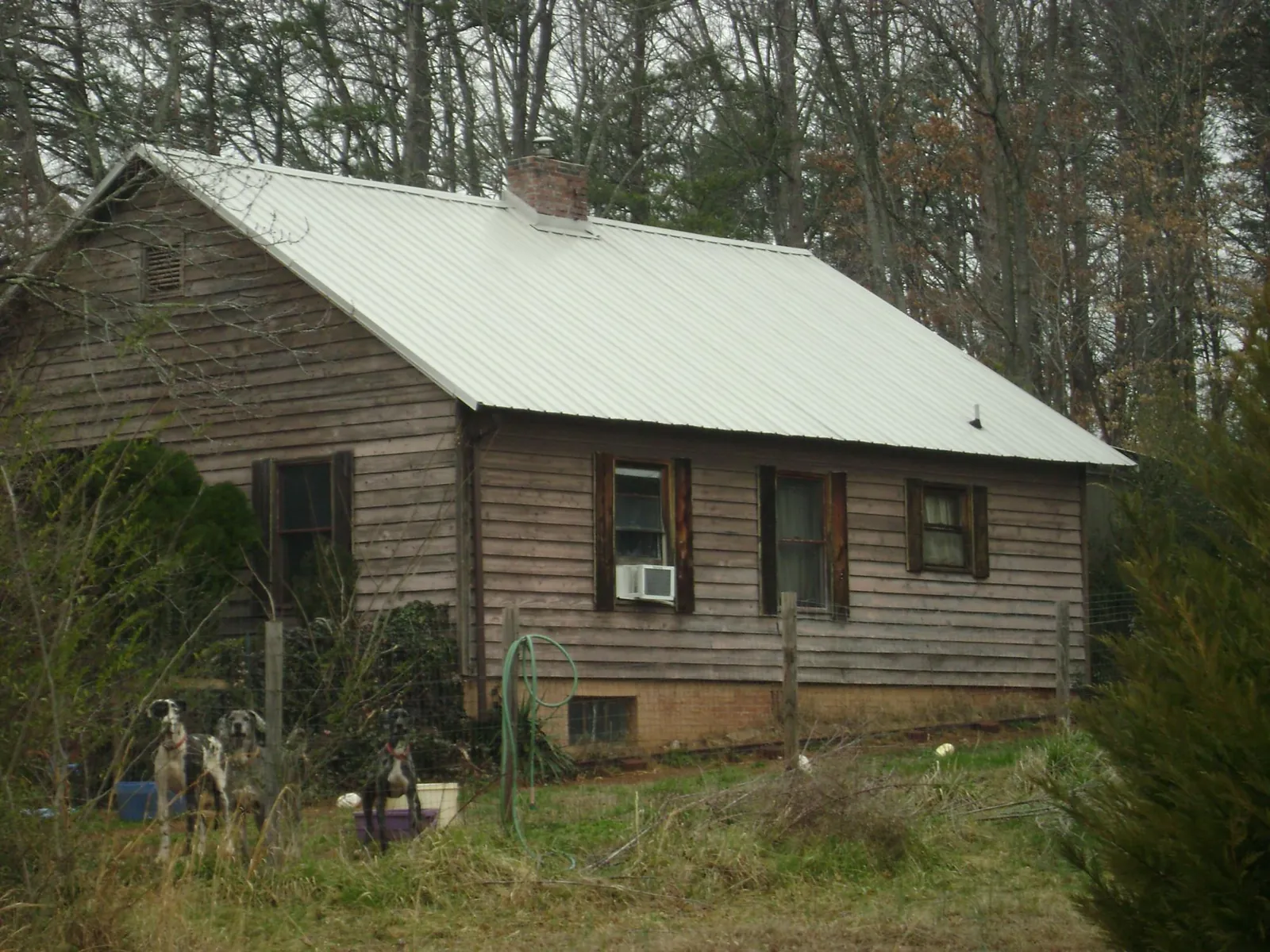 White metal roof on an old wood sided farmhouse, from a Metal Roof Installation job in Sorrento